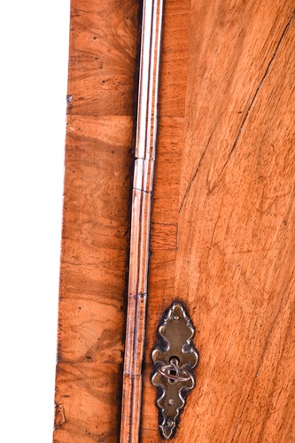 Lot 530 - A Georgian walnut long case clock, the arched...