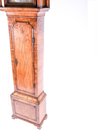 Lot 530 - A Georgian walnut long case clock, the arched...