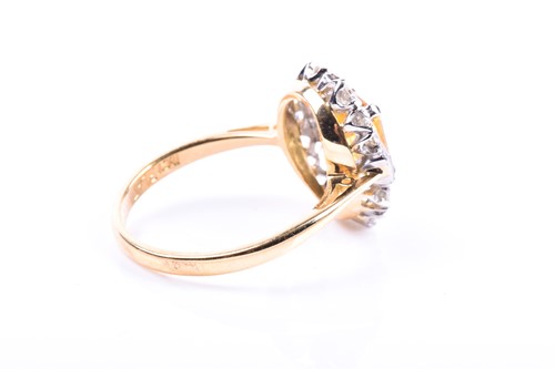 Lot 42 - A diamond and yellow sapphire cluster ring,...