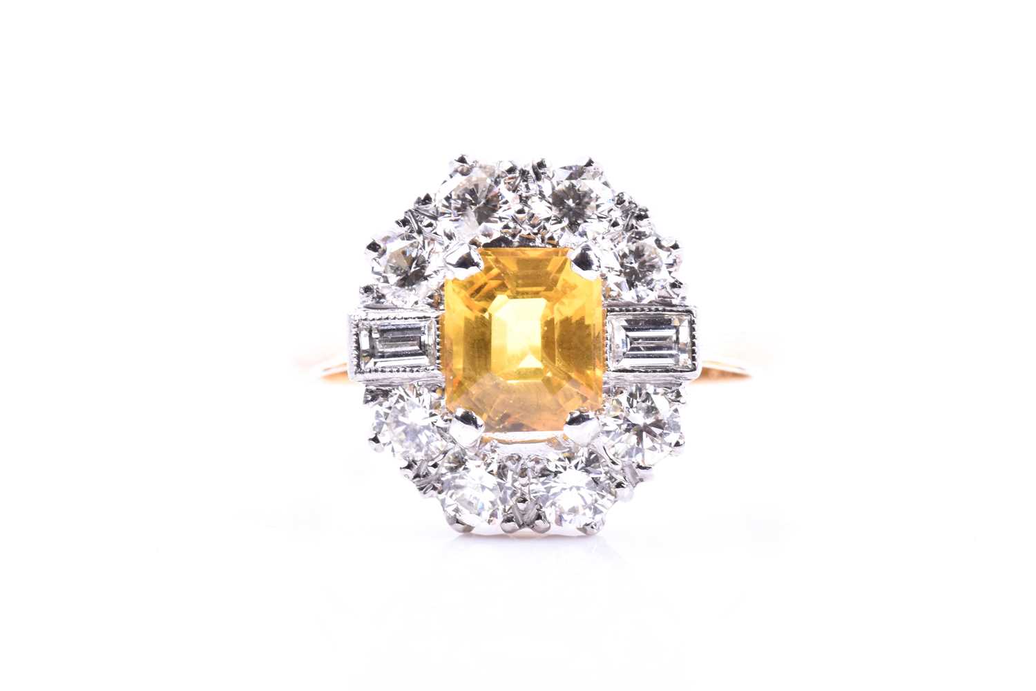 Lot 42 - A diamond and yellow sapphire cluster ring,...