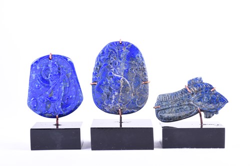 Lot 198 - Two Chinese lapis lazuli pendants, one carved...