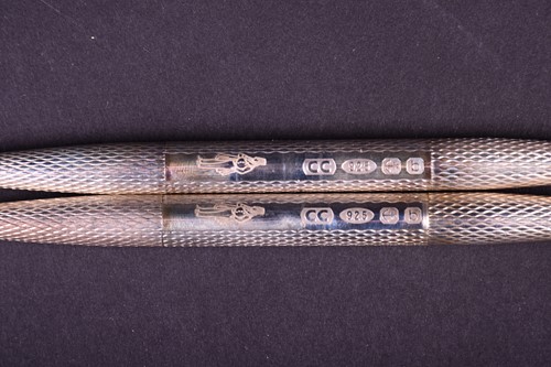 Lot 478 - A pair of silver double ended ballpoint pens,...
