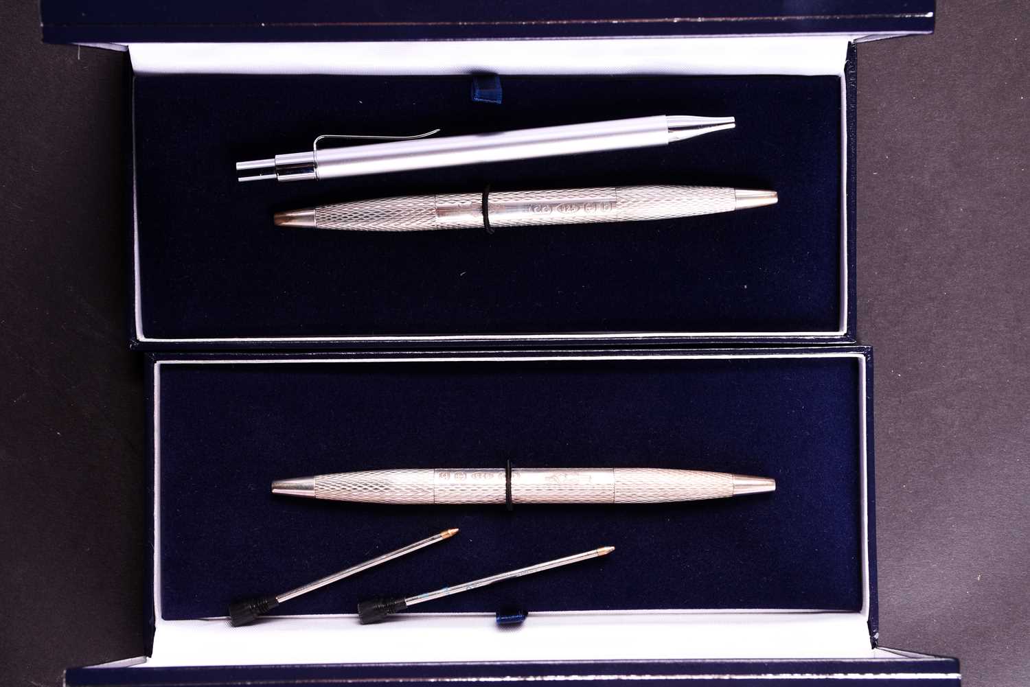 Lot 478 - A pair of silver double ended ballpoint pens,...