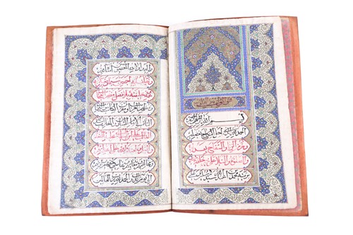 Lot 235 - A leather bound booklet of Persian script,...