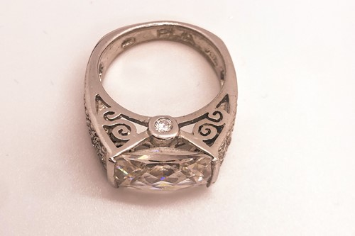 Lot 746 - A 9ct yellow gold and black CZ ring, together...