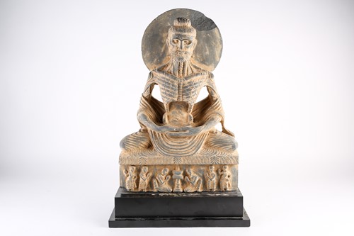 Lot 269 - A Gandharan style schist figure of an...