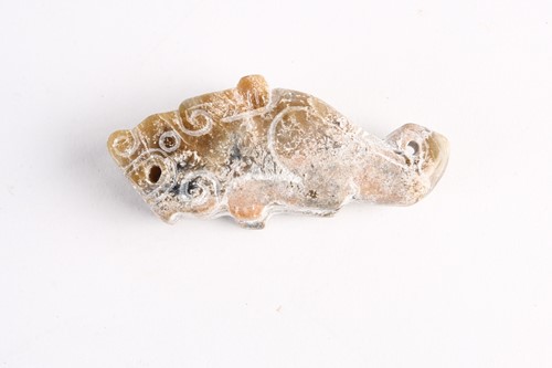 Lot 282 - A Chinese jade feline pendant, Han dynasty, of...