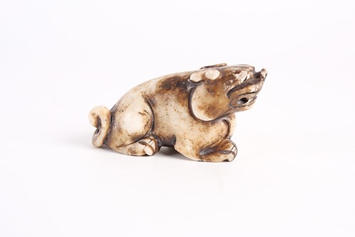 Lot 284 - A Chinese jade lion dog, Qing dynasty, late...