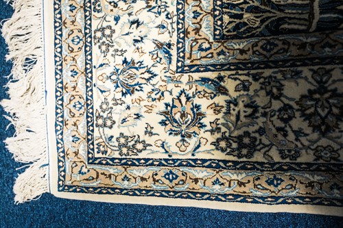 Lot 270 - A 20th century Nain rug with flowering shrub...