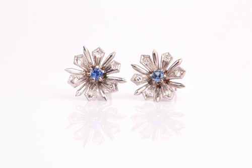 Lot 269 - A pair of white and blue sapphire floral...