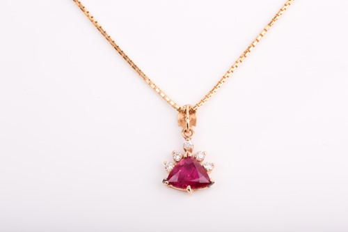 Lot 410 - A yellow metal, ruby, and diamond pendant, set...