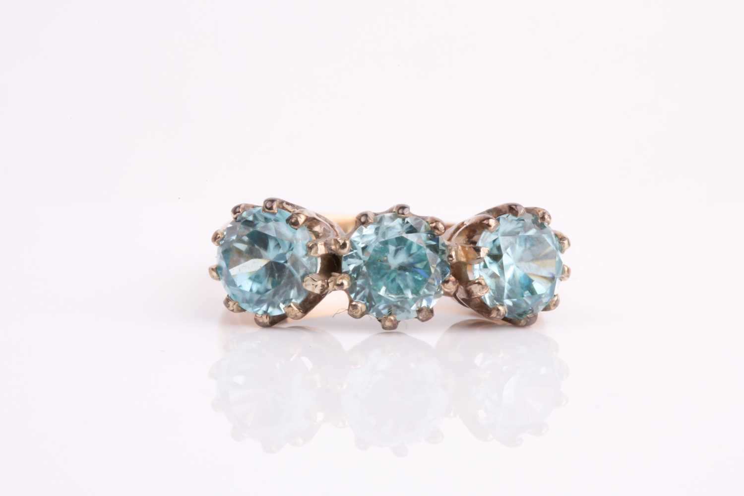 Lot 264 - A 9ct yellow gold and blue zircon ring, set...