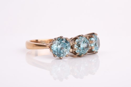 Lot 264 - A 9ct yellow gold and blue zircon ring, set...