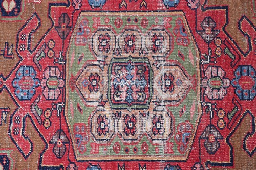 Lot 277 - An old Serab rug with a geometric lozenge...