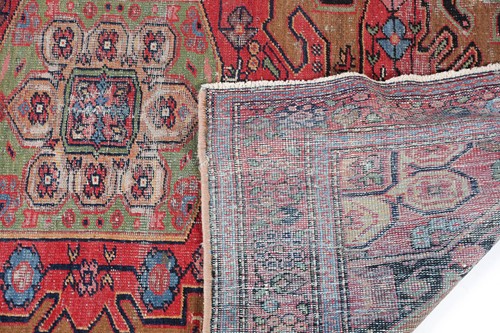 Lot 277 - An old Serab rug with a geometric lozenge...