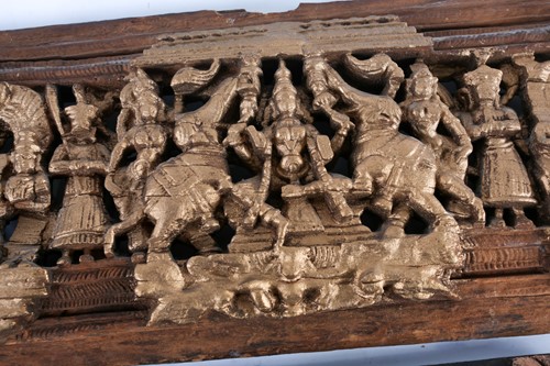 Lot 164 - A deeply carved, and gilt Indian hardwood...