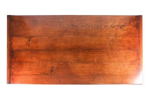 Lot 88 - A 17th century style oak refectory table by G,...