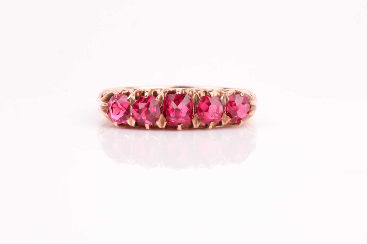 Lot 187 - A five stone half hoop spinel ring, the...