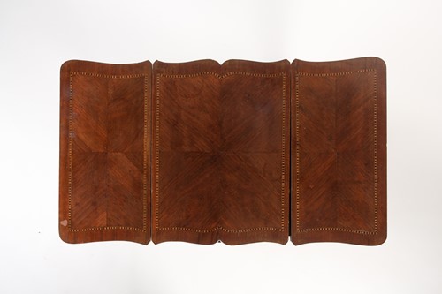 Lot 101 - A Louis XVI style parquet line inlaid mahogany...