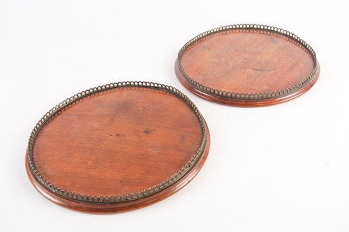 Lot 331 - A pair of Victorian circular, mahogany trays...