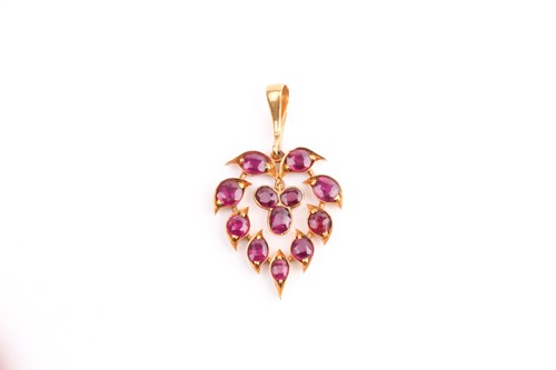 Lot 400 - A ruby set foliate pendant, of leaf shape with...