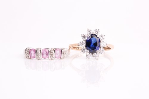 Lot 315 - A pink sapphire and diamond half hoop ring in...