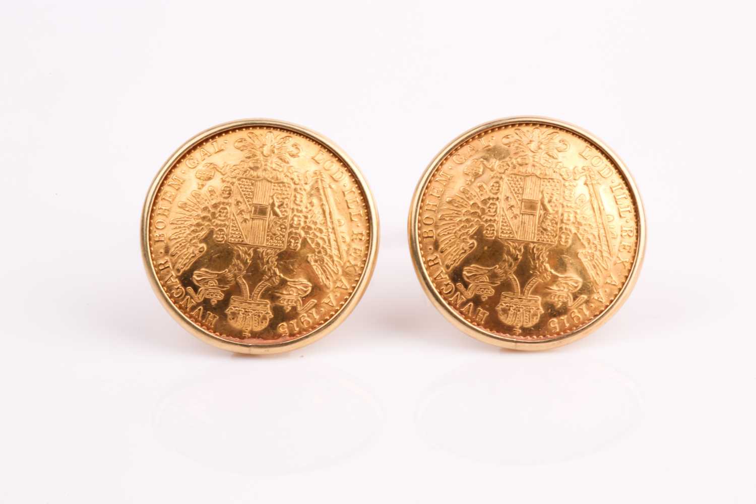 Lot 382 - A pair of coin cufflinks. Made from Austrian...