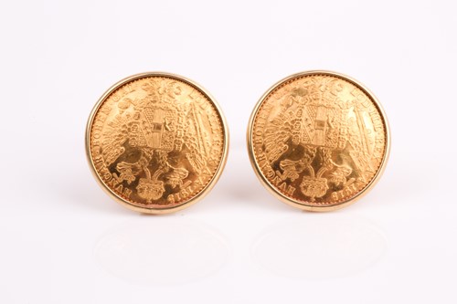 Lot 382 - A pair of coin cufflinks. Made from Austrian...