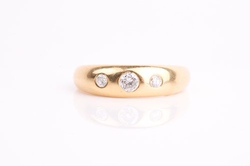 Lot 252 - A gentleman's three stone diamond ring; the...