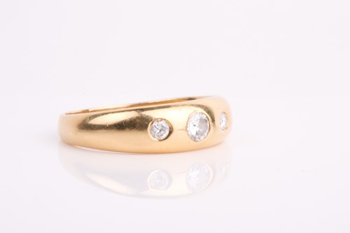 Lot 252 - A gentleman's three stone diamond ring; the...