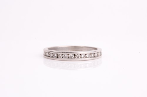 Lot 395 - A diamond set eternity ring, the round...
