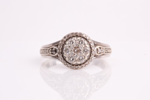 Lot 437 - A diamond cluster ring, the halo set, central...