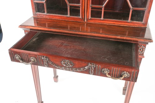 Lot 105 - A Geo III style carved mahogany console...