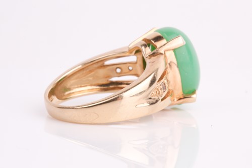 Lot 108 - A jade and diamond ring, the oval jade...