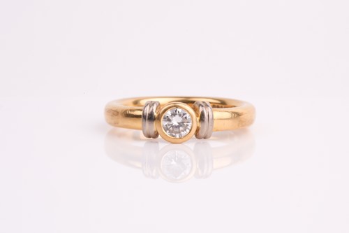 Lot 342 - A single stone diamond ring in two colour 18ct...