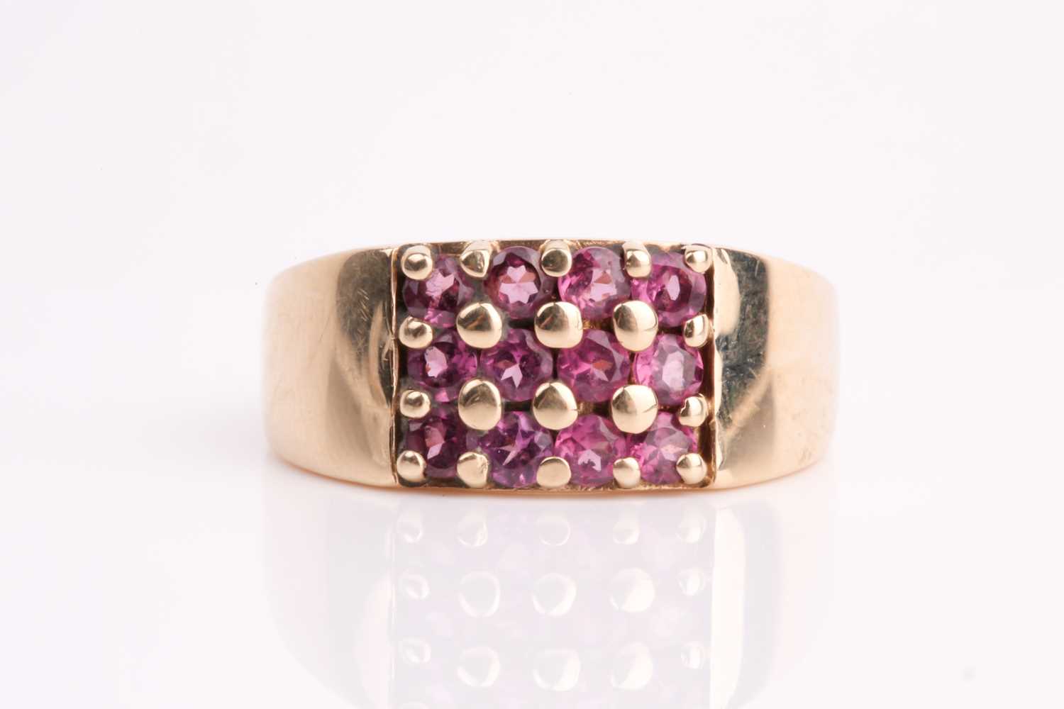 Lot 111 - A rectangular pink tourmaline cluster ring, in...