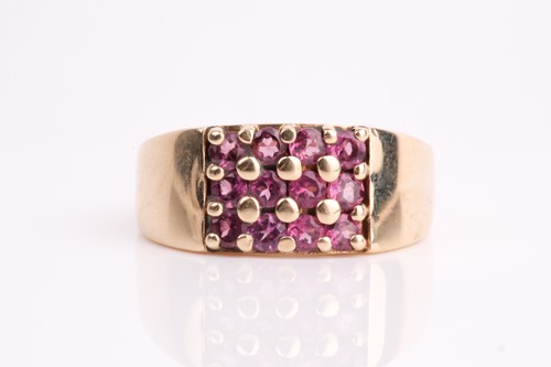 Lot 111 - A rectangular pink tourmaline cluster ring, in...