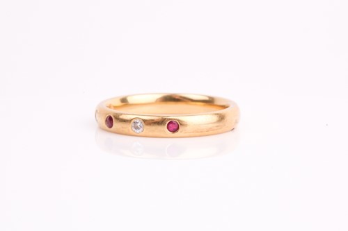 Lot 212 - A diamond and ruby half eternity ring, the...