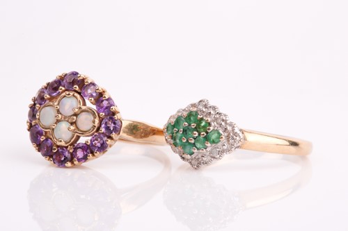 Lot 244 - An emerald and diamond cluster ring,...