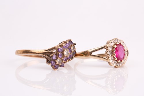 Lot 189 - A ruby and diamond oval cluster ring together...