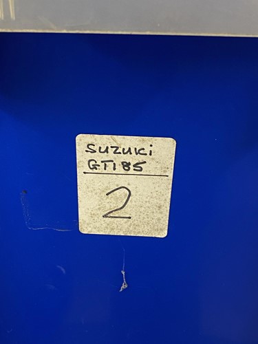 Lot 18 - Suzuki GT185. Two 1979 blue part motorcycles,...