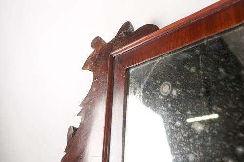Lot 117 - A George IV mahogany scroll frame wall mirror...