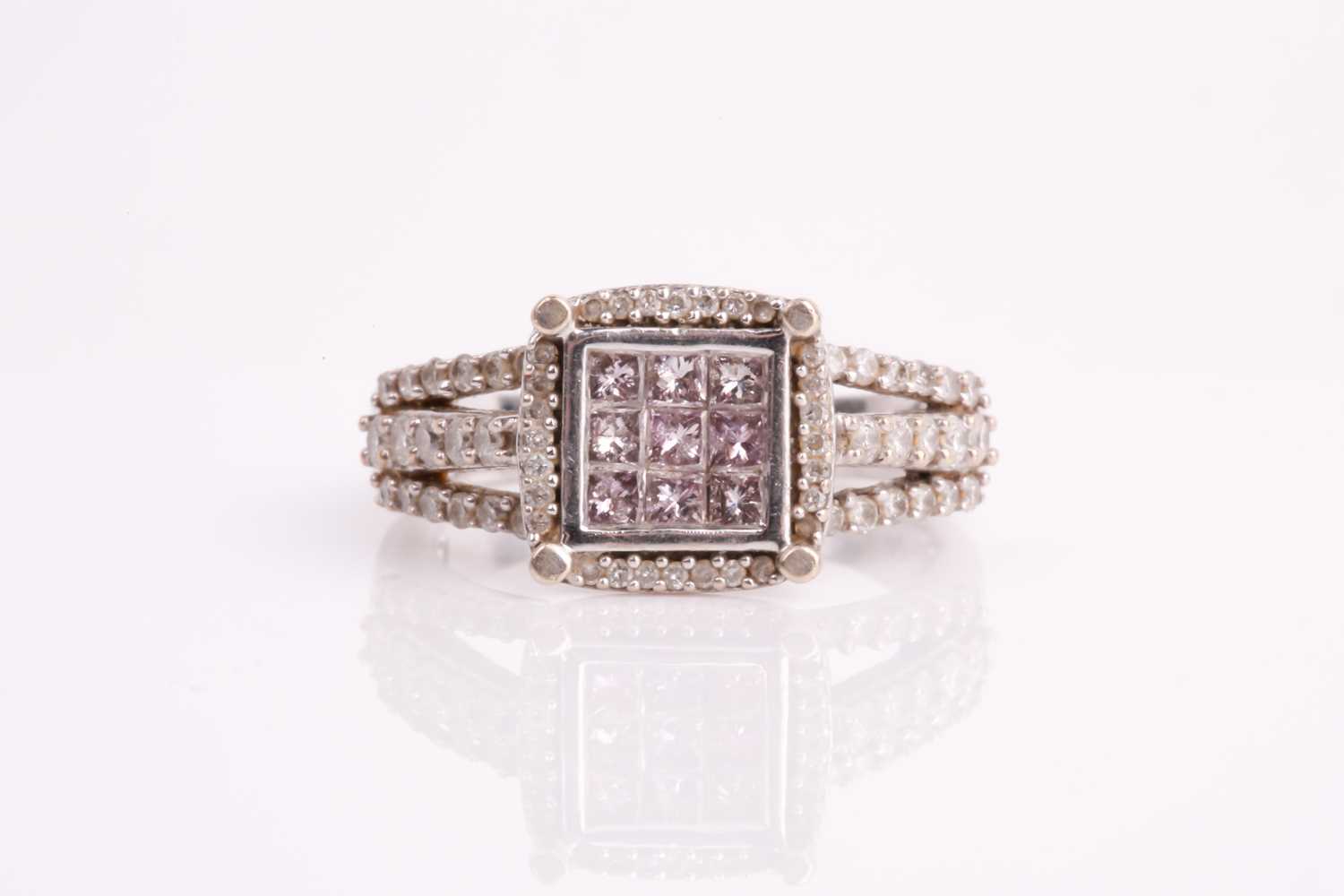 Lot 284 - A diamond and pink diamond 14ct gold cluster...
