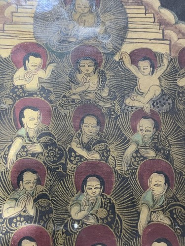 Lot 185 - A framed Tibetan Thangka depicting multiple...
