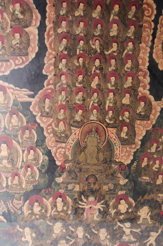 Lot 185 - A framed Tibetan Thangka depicting multiple...