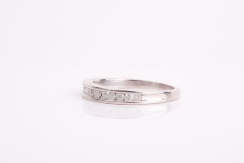 Lot 178 - A diamond half-eternity ring, channel-set with...
