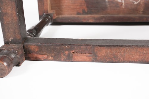 Lot 131 - A part 17th century oak long stool with 'thumb'...