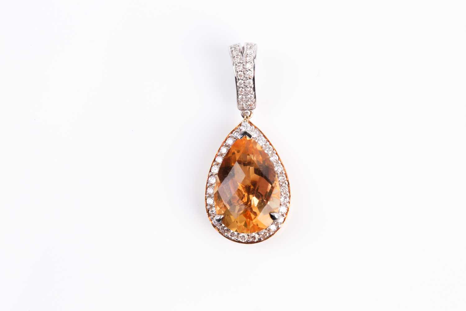 Lot 246 - A citrine and diamond cluster pendant, the...