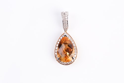 Lot 246 - A citrine and diamond cluster pendant, the...