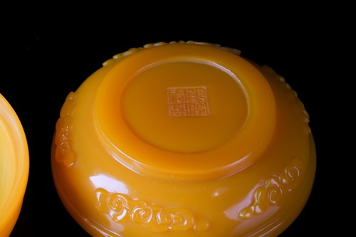 Lot 219 - A Chinese, Peking yellow glass, circular...
